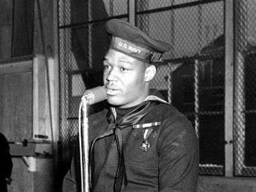 Miller speaks during a war bond tour stop at the Naval Training Station in Great Lakes, Ill., on Jan. 7, 1943.
