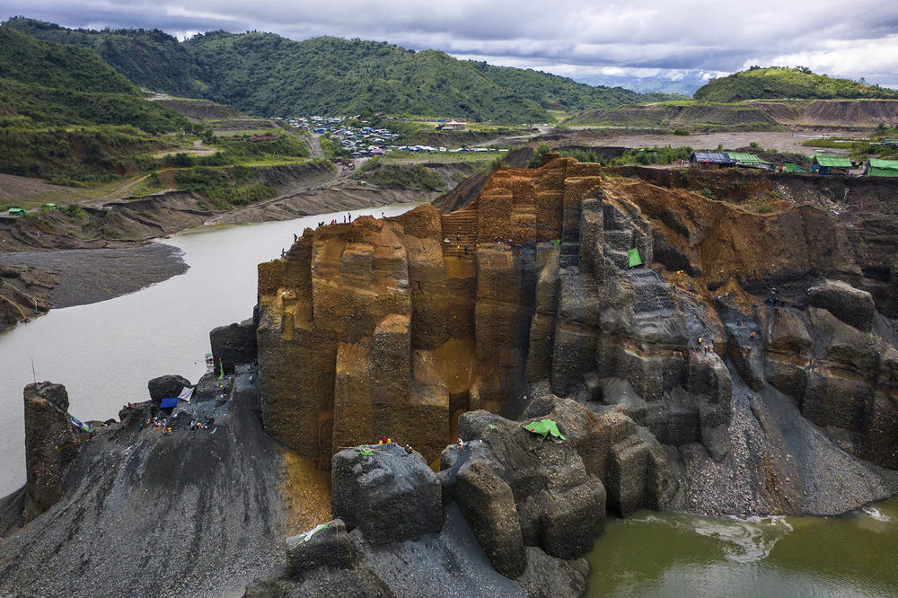 Miners dig for jade on a government-licensed site.