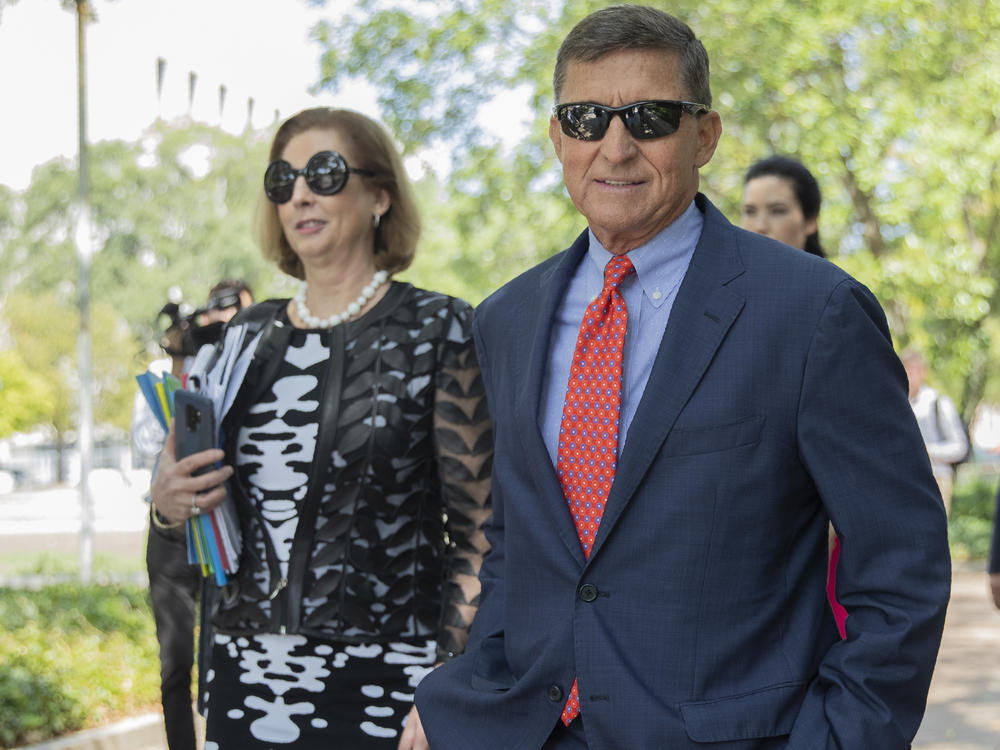 Michael Flynn, President Trump's former national security adviser, leaves federal court with lawyer Sidney Powell in September 2019.