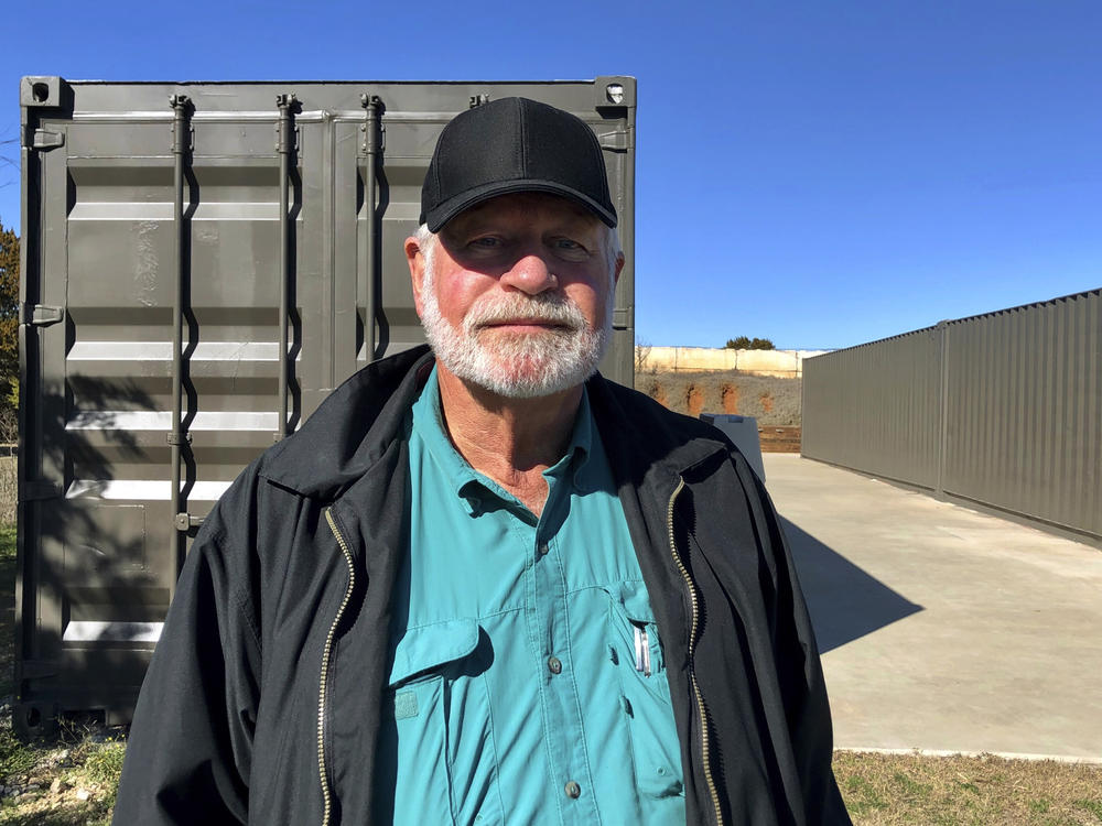 Jack Wilson poses for a photo at a firing range outside his home in Granbury, Texas. Wilson, who trains the volunteer security team of the West Freeway Church of Christ, killed a man who fatally shot two people there on Dec. 29.