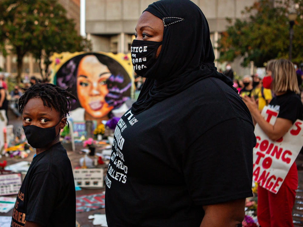 The grand jury recording in the Breonna Taylor case will be released, after a judge ordered the attorney general's office to produce the recording by Wednesday. Here, a mother and son attend a demonstration in what activists are now calling Injustice Square Park in downtown Louisville, as protesters demand justice for Taylor's killing by police.