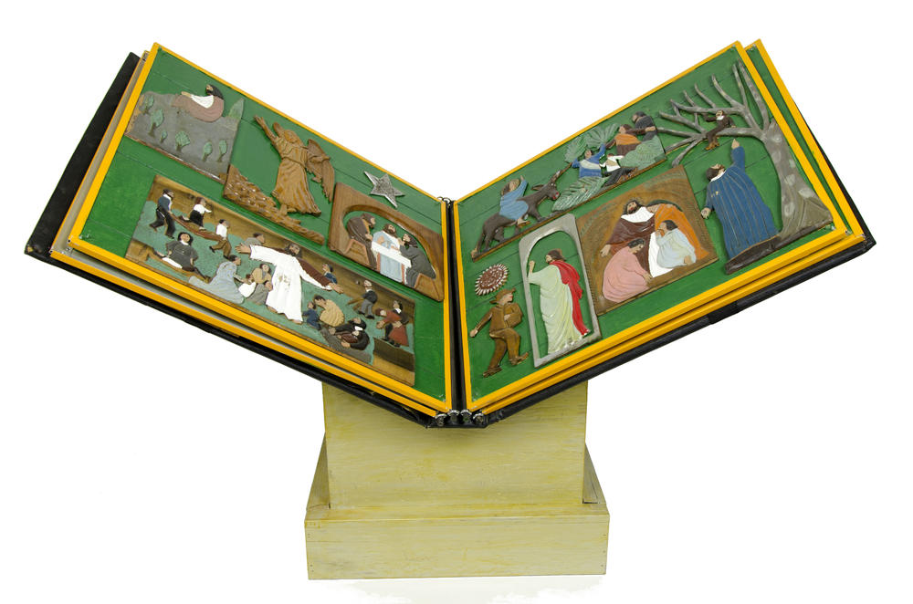 Elijah Pierce's <em>The Book of Wood,</em> 1932, paint on carved wood, mounted on wood panels