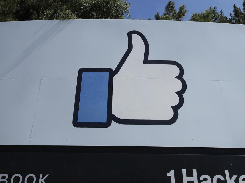 The thumbs up Like logo is shown on a sign at Facebook headquarters in Menlo Park, Calif.