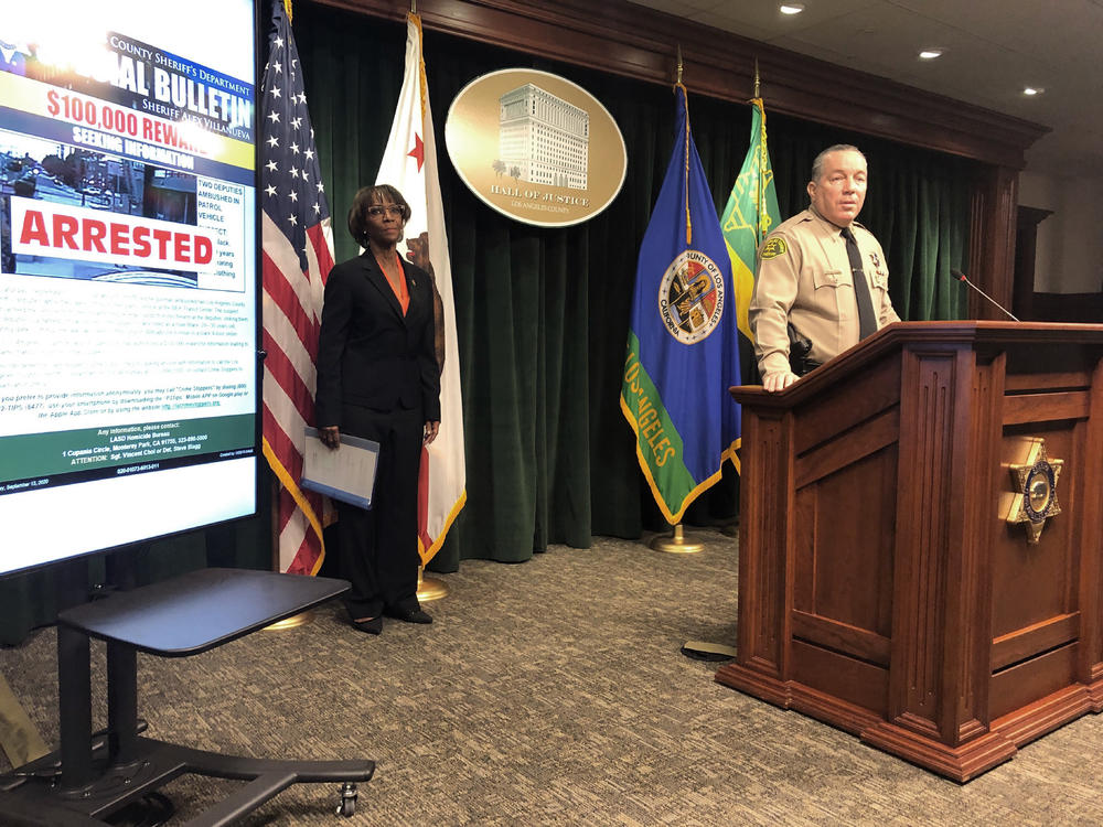 Los Angeles County Sheriff Alex Villanueva, right, and District Attorney Jackie Lacey, at a news conference on Wednesday announce the arrest of a man in connection with the shooting of two Los Angeles County sheriff's deputies.