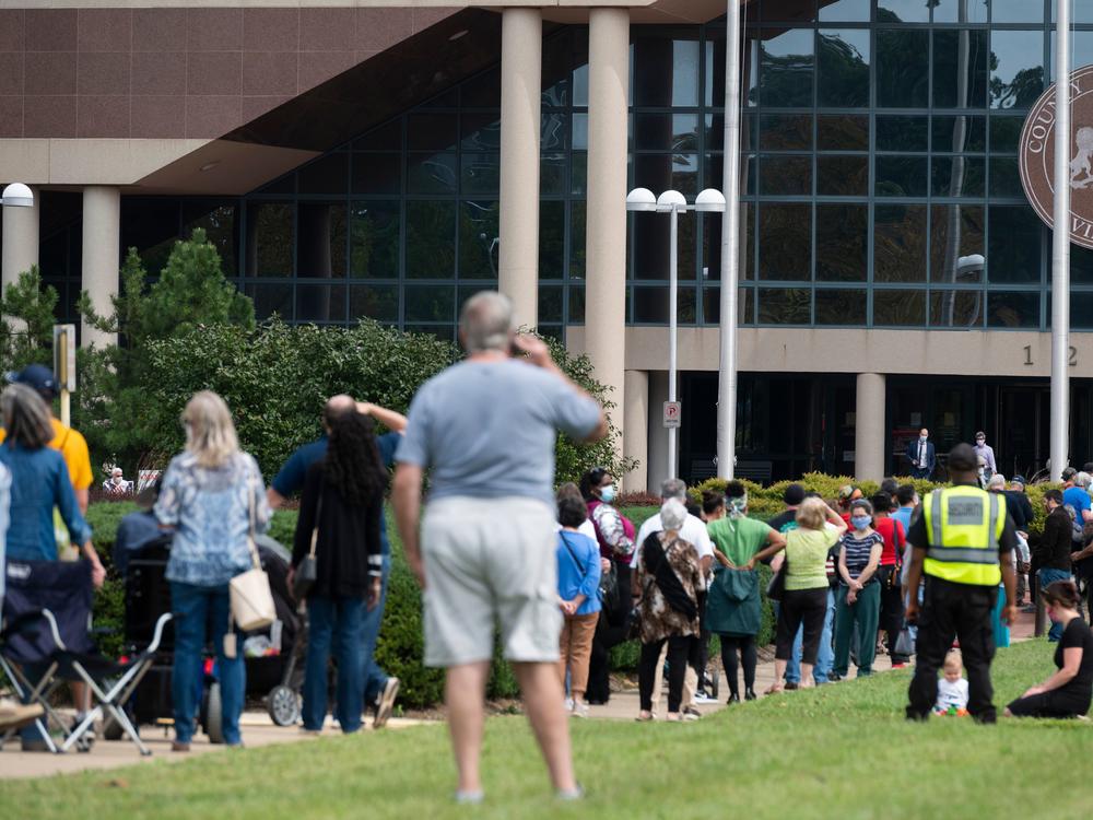 Voters wait in line to cast their ballot at an early voting location in Fairfax, Va., on Sept. 18. Growing tensions in the country have some election officials worried about potential violence at polling places.