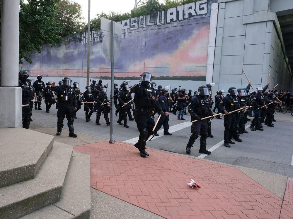 A police line approaches demonstrators in downtown Louisville, Ky., last week during protests over the lack of criminal charges in the police killing of Breonna Taylor and the result of a grand jury inquiry.