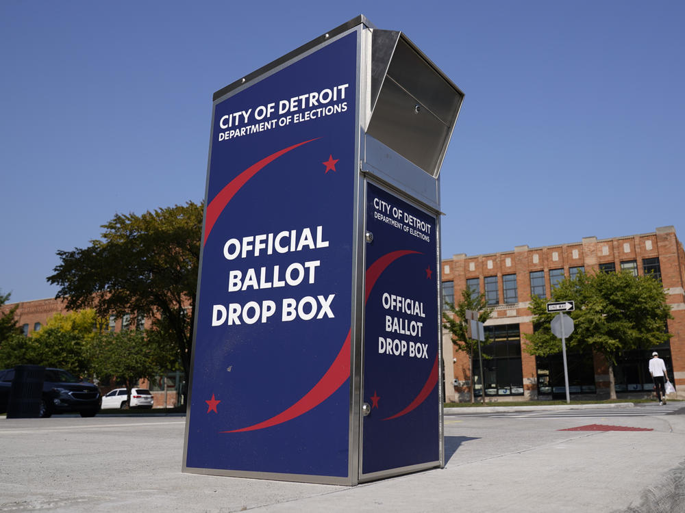 Voters can drop off absentee ballots at a ballot drop box in Detroit instead of using the mail.