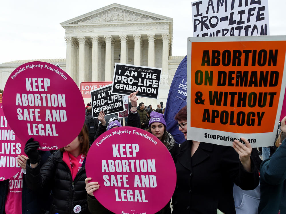 Activists on opposite sides of the abortion debate demonstrate in front of the Supreme Court during the annual anti-abortion-rights event known as the March for Life, on Jan. 24 in Washington, D.C.