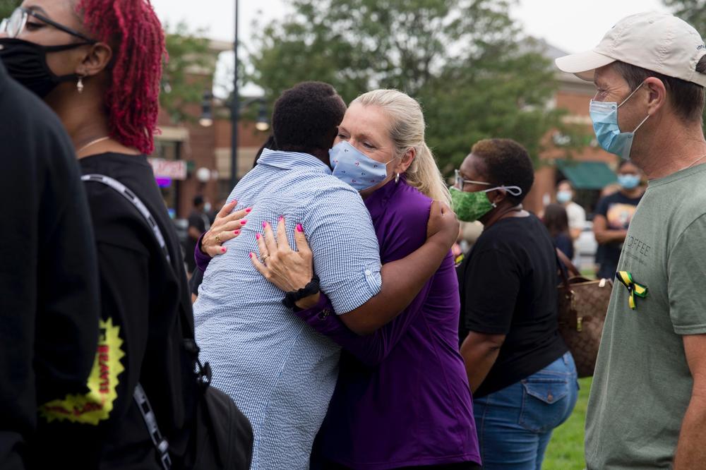 Sharon Koorbusch, right, hugs Thomas at a march for Thomas's son Fitz in Landsdowne, Va. in August. Koorbusch and her husband tried to save Fitz on the day he drowned.