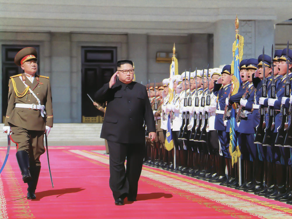 Kim Jong Un inspects troops ahead of North Korea's 70th anniversary parade in Pyongyang in 2018. At least one foreign policy expert warns that U.S. adversaries could take advantage of the uncertainty stemming from President Trump's positive coronavirus test.