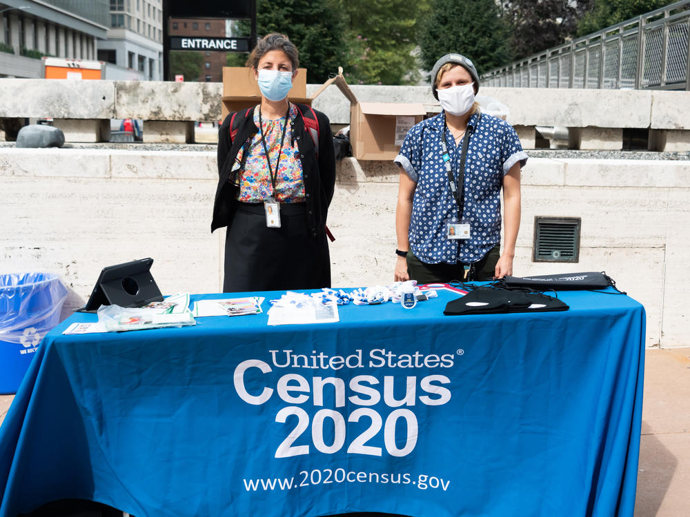 U.S. Census Bureau workers stand outside Lincoln Center in New York City in September. A federal judge has ordered the bureau to keep counting for the 2020 census through Oct. 31 for now.