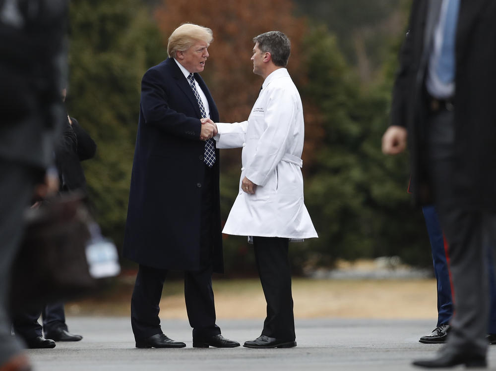 President Trump shakes hands with now-former White House physician Dr. Ronny Jackson in January 2018 following his first medical checkup as president.