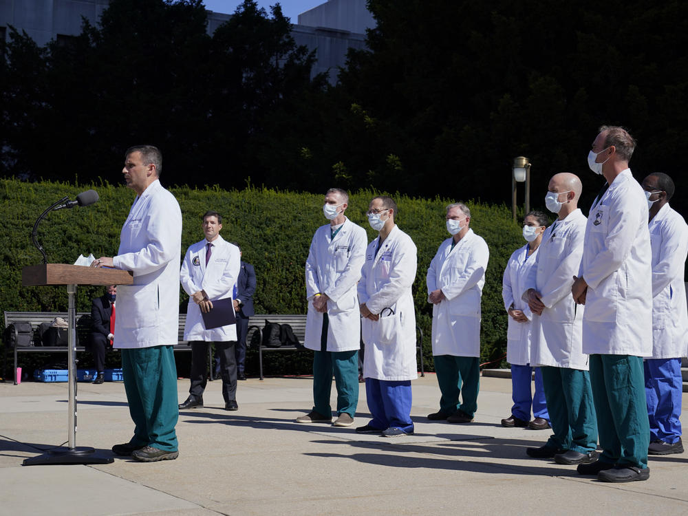 Dr. Sean Dooley briefs reporters at Walter Reed National Military Medical Center in Bethesda, Md. on Saturday. Trump was admitted to the hospital after contracting the coronavirus.