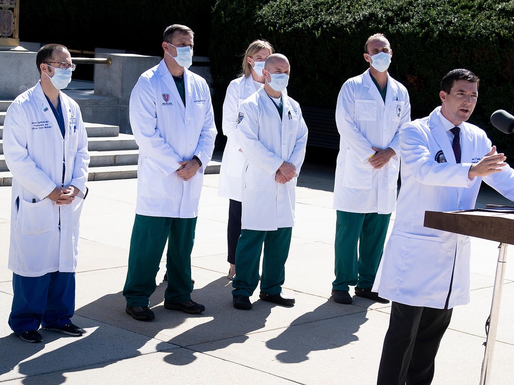 White House physician Dr. Sean Conley, with medical staff, gives an update on the condition of President Trump on Saturday at Walter Reed Medical Center in Bethesda, Md.