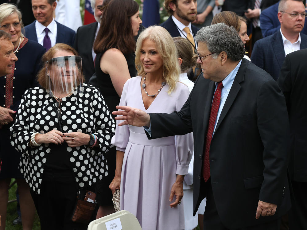 Kellyanne Conway and Attorney General William Barr talk with guests in the Rose Garden. The former White House adviser tested positive on Friday night.