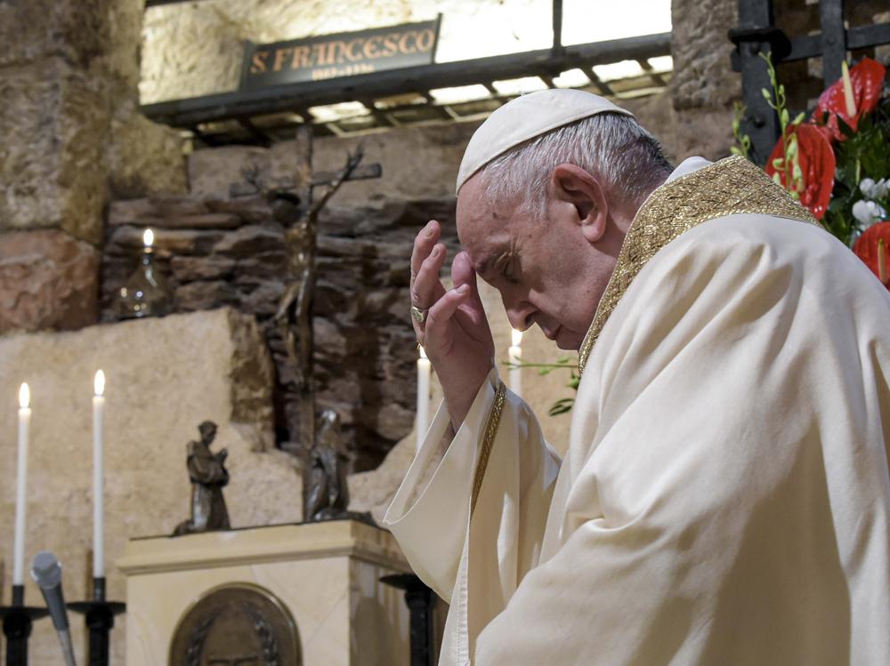 Pope Francis celebrates Mass in the crypt of the Basilica of St. Francis, in Assisi, Italy, on Oct. 3.