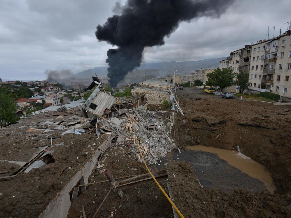 Smoke rises in the aftermath of recent shelling during the ongoing fighting between Armenia and Azerbaijan on Sunday.