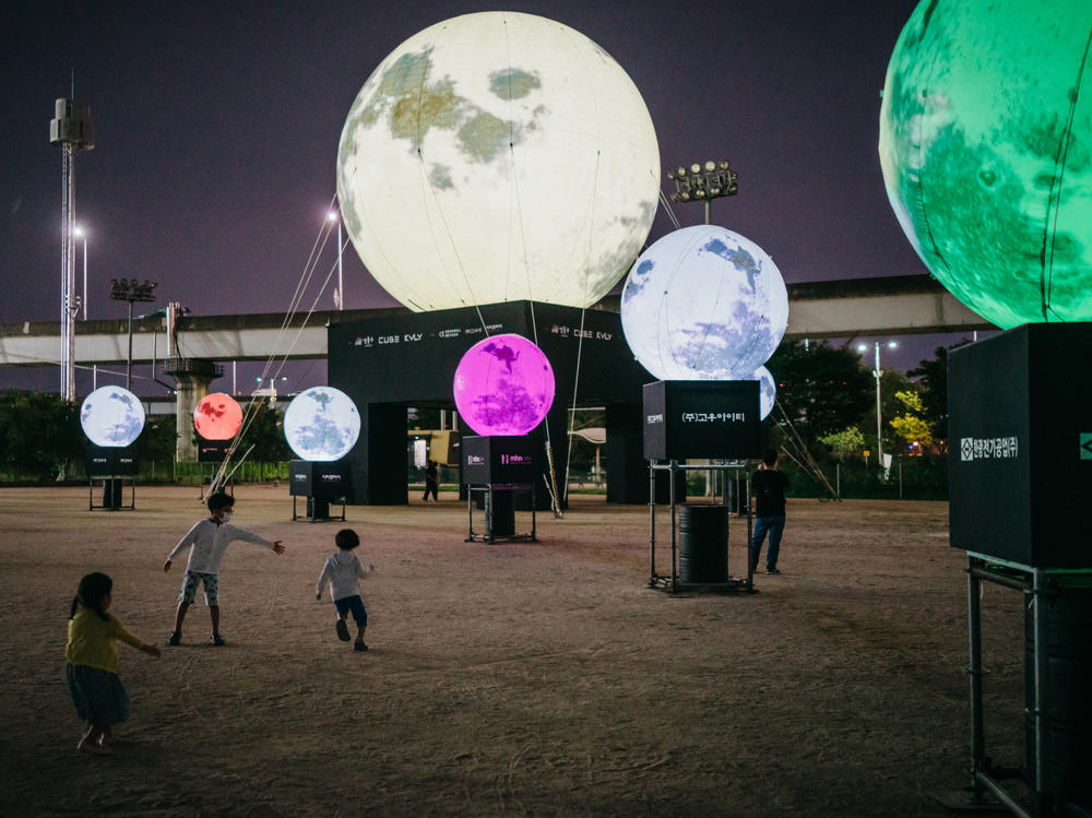 A day before the Chuseok holiday, children run around artificial full moons, part of an installation at a park in eastern Seoul. Koreans believe that wishes made to the full moon on Chuseok will come true. The Seongdong District Office teamed up with local businesses to install the moons as a way to convey hope in the time of COVID-19.