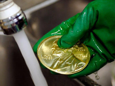 A Nobel Prize gold medal seen during the manufacturing process in the Swedish Mint. The medals, presented to each laureate, are made of 18 karat recycled gold and weigh 175 grams (6.13 ounces). The economics medal weighs 185 grams (6.48 ounces).