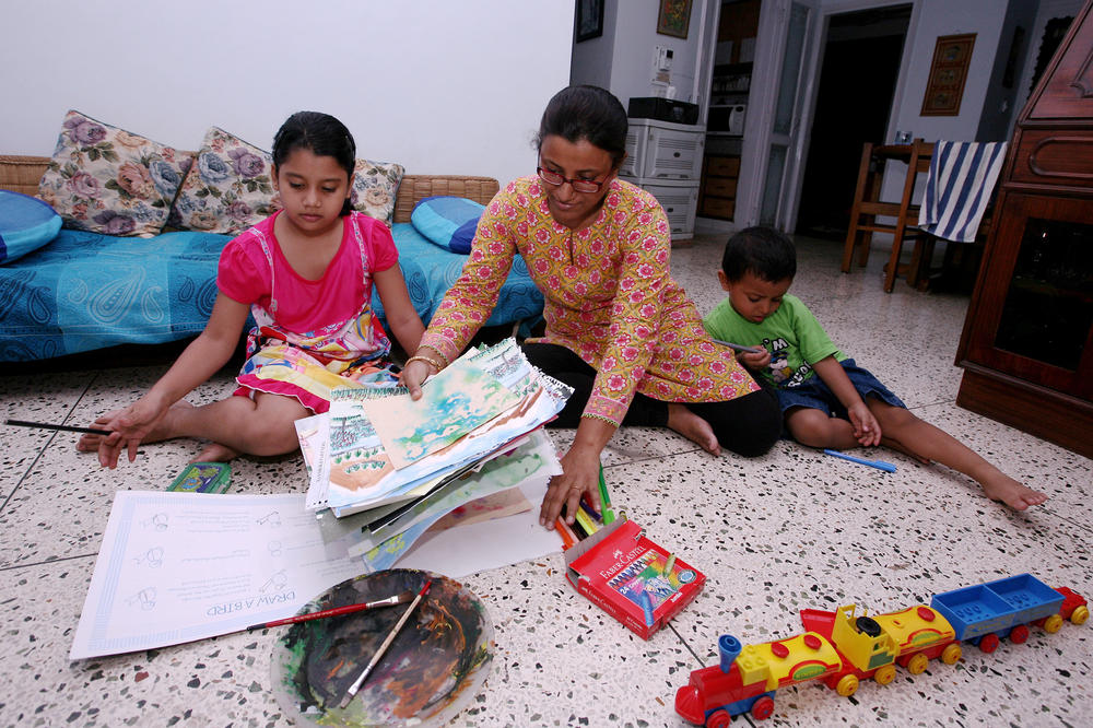Dola Banerjee homeschools her children in New Delhi in August.
