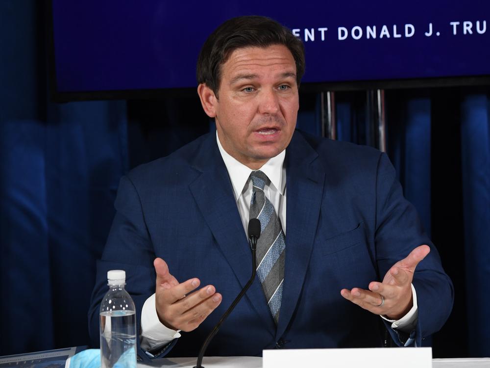 Florida Gov. Ron DeSantis, seen here in July, has extended the voter registration deadline by a day after the state's online portal crashed Monday.