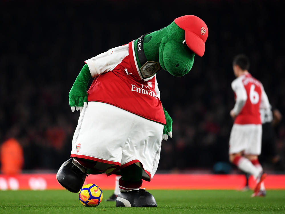 Gunnersaurus is seen warming up prior to a match at Emirates Stadium in 2017 in London. Jerry Quy, who played the team's mascot Gunnersaurus for 27 years, was recently told he would be let go.