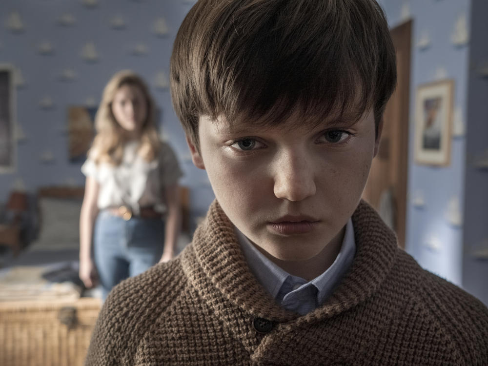 What's creepier: The kid (Benjamin Evan Ainsworth) or the high-waisted jeans on the au pair (Victoria Pedretti)? <em>The Haunting of Bly Manor</em> makes a case for both.
