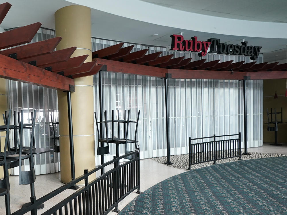 Chairs are stacked outside a closed Ruby Tuesday restaurant at Orlando Intercontinental Airport on May 24, 2020.