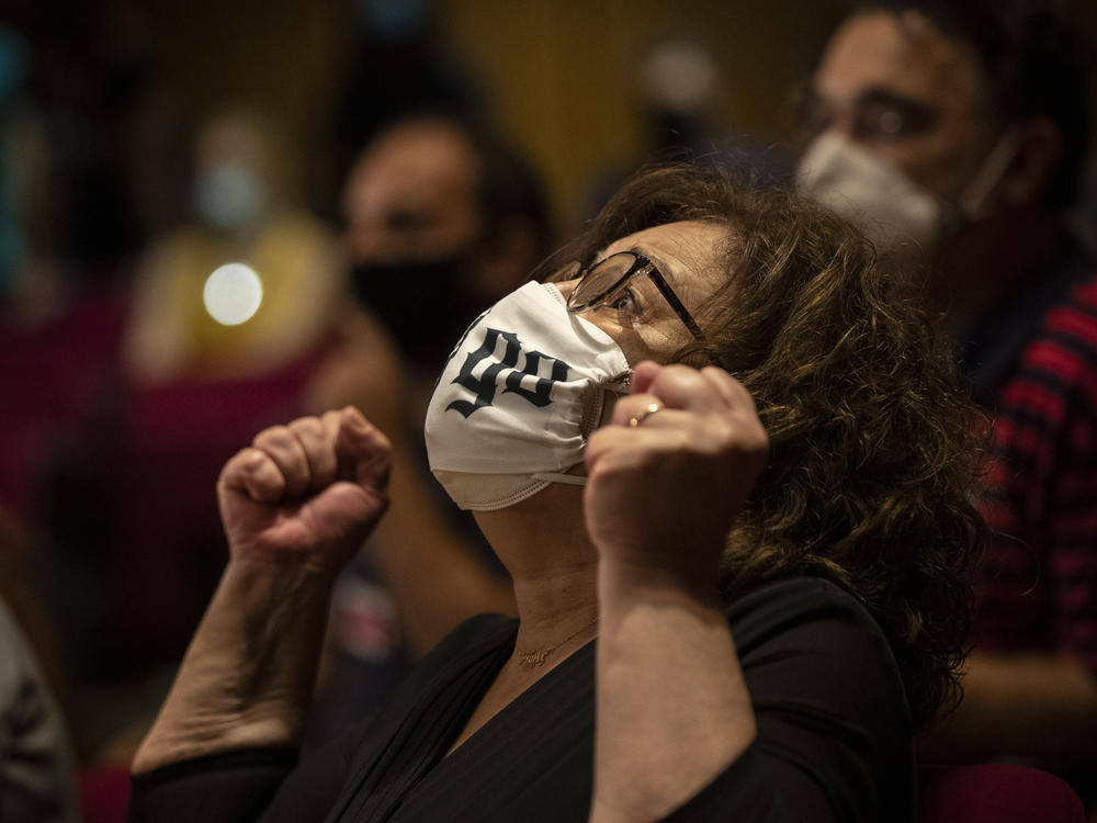 Magda Fyssa, the mother of late Greek singer Pavlos Fyssas, reacts immediately after three judges convicted Golden Dawn members of murdering her son, in Athens on Wednesday. She burst into tears and pumped her fists, looking up at the sky. 