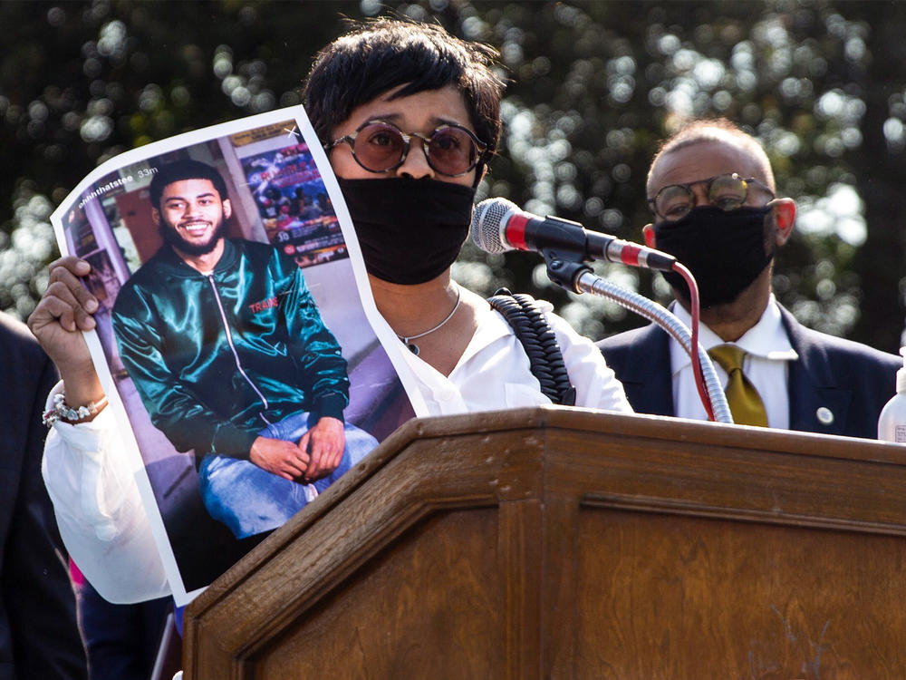 Tamika Morales holds a photo of her son, Ahmad, who was killed in South Philadelphia last July.