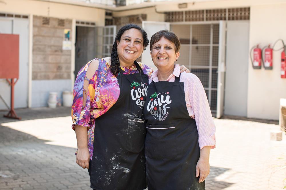 Aleya Kassam, left, and her mother, Narmin, pose for a portrait outside the apartment they rented to run their growing samosa business.