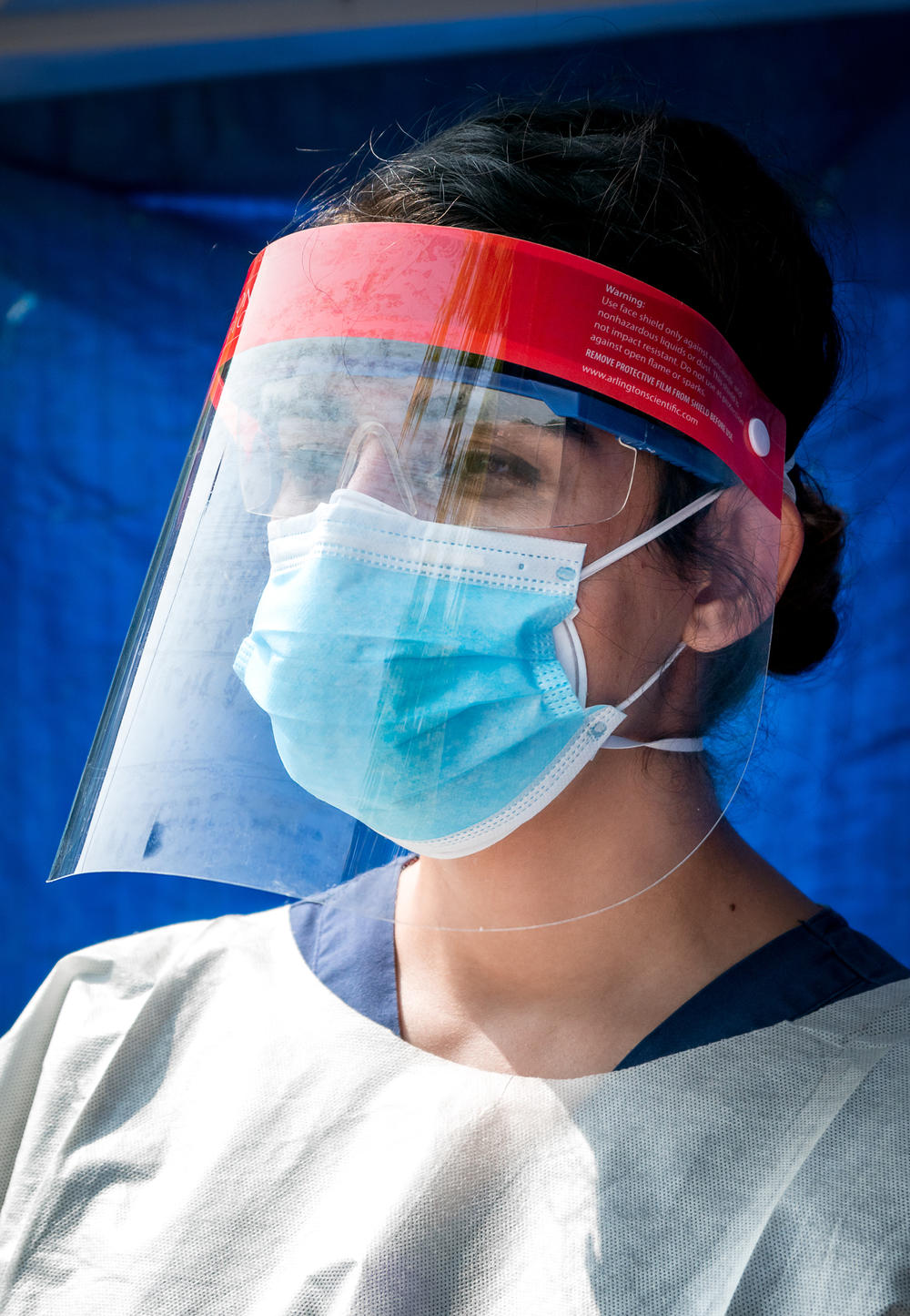 Shafaq dons personal protective equipment for her job — and strips it off in her garage when her shift is over so she doesn't put her roommates at risk.