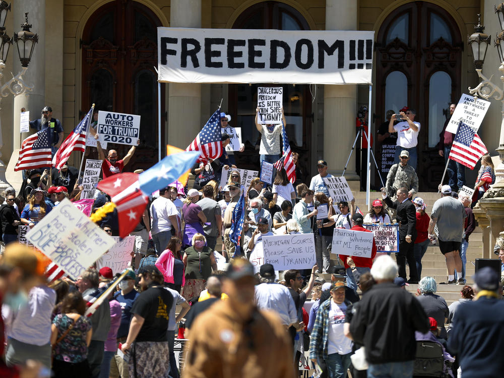 People protest at the state Capitol during a rally in Lansing, Mich., in May against Gov. Gretchen Whitmer's stay-at-home order.