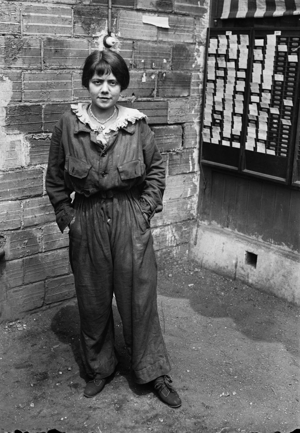 A French woman in overalls with lace collar, 1917