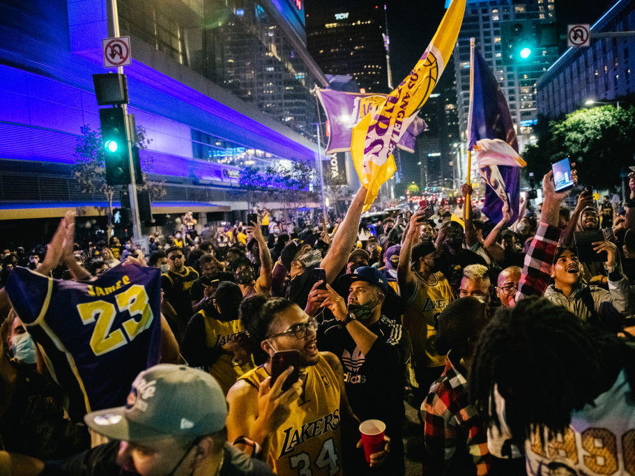Lakers fans celebrate in front of the Staples Center on Sunday in Los Angeles. People gathered to celebrate after the Lakers' defeat of Miami for the NBA championship.