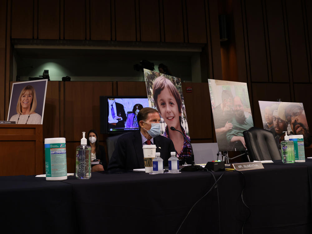 Democrats on the Senate Judiciary Committee display photos of people who have been impacted by the Affordable Care Act, as the lawmakers argue that confirming Amy Coney Barrett to the Supreme Court would be detrimental to health care.