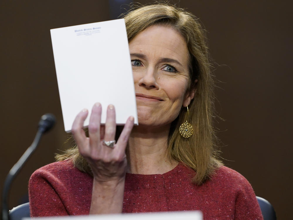 Supreme Court nominee Amy Coney Barrett responds to a question from Sen. John Cornyn, R-Texas, about the materials she used at her hearing on Tuesday: none. She displayed an unused Senate notepad.
