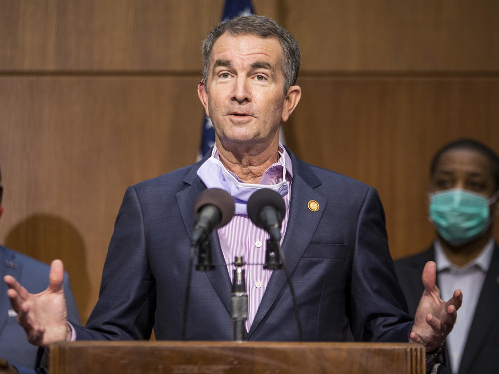 Virginia Gov. Ralph Northam was mentioned as a potential target for kidnapping when a group met to discuss plots to punish governors for their response to the coronavirus, the FBI says. Northam is seen here at a news conference in June in Richmond.