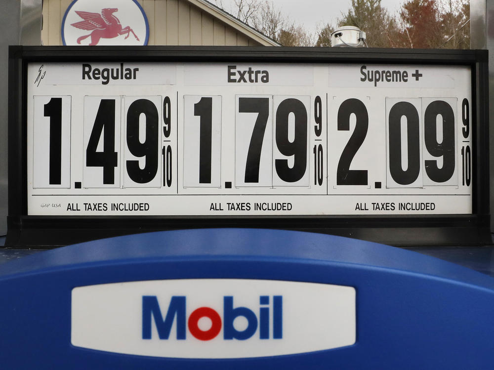 Gasoline prices are posted at a Mobil gas station in Candia, N.H., on April 30. The coronavirus pandemic has renewed a critical debate about just when global oil demand will peak.