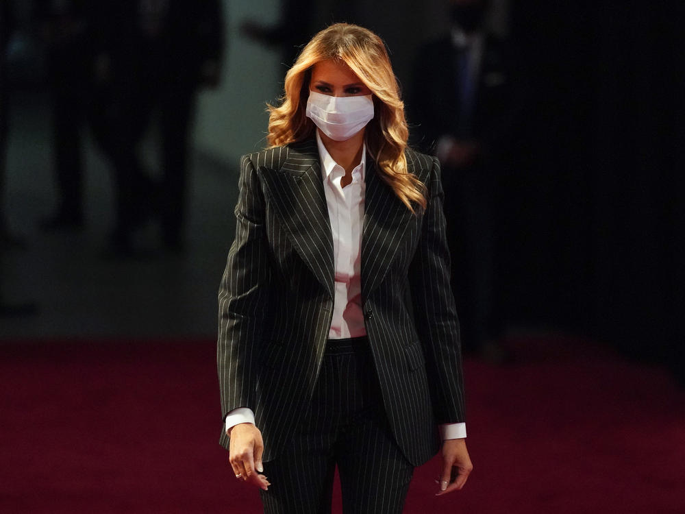 First lady Melania Trump, pictured wearing a face mask at the presidential debate on Sept. 29, said she and the Trumps' son Barron, no longer test positive for the coronavirus.