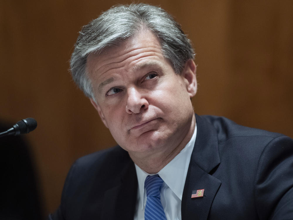 FBI Director Christopher Wray testifies before the Senate's Homeland Security Committee on Sept. 24. Wray and other national security officials say they've taken extensive safeguards to protect this year's election. This message is often in sharp contrast with President Trump, who has repeatedly questioned the integrity of the vote.