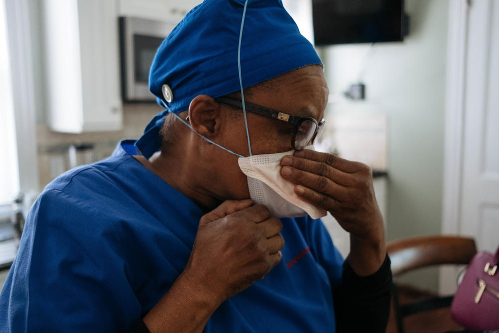 Health care workers were forced to come up with ways to preserve N95 masks. Raymonde Elian wore three masks so that the N95 was less exposed.