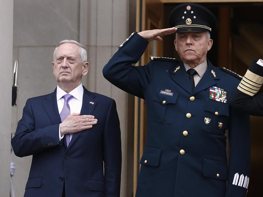 Former Mexican Defense Secretary Gen. Salvador Cienfuegos, right, with former U.S. Defense Secretary Jim Mattis at the Pentagon in 2017. Cienfuegos was arrested on a DEA warrant at Los Angeles International Airport Thursday.