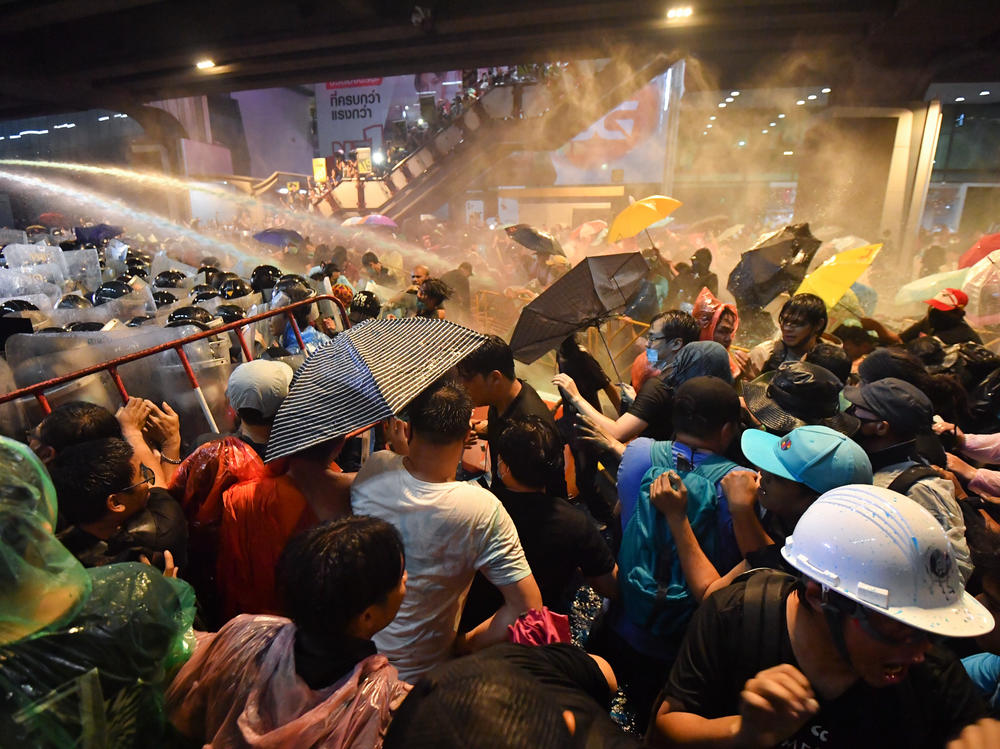 Riot police use water cannons to disperse pro-democracy protesters during an anti-government rally in Bangkok on Friday.