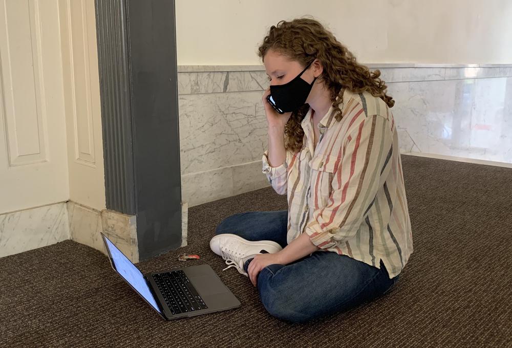 Common Cause worker Dana Abelson calls voters in Florida from her apartment building in Washington, D.C., to help them fix problems with their absentee ballots in advance of Election Day.