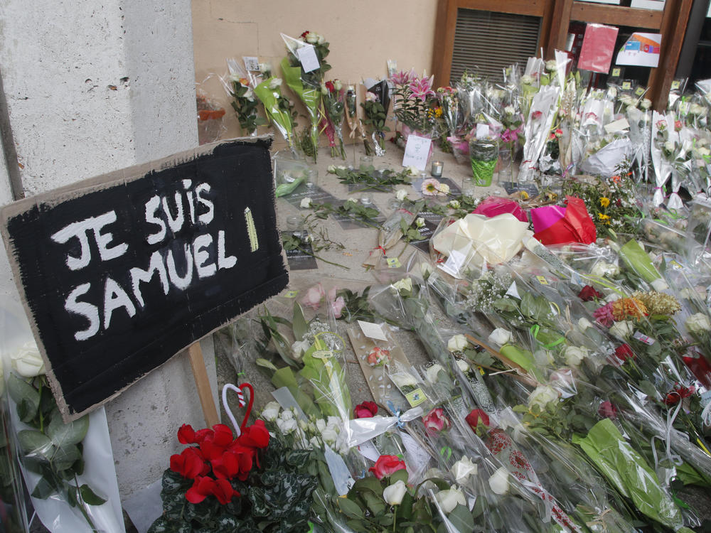 Authorities in France say they've detained nine people in connection with the decapitation of a history teacher in a Paris suburb on Friday. The teacher had shown caricatures of the Prophet Muhammad to his class, authorities said.