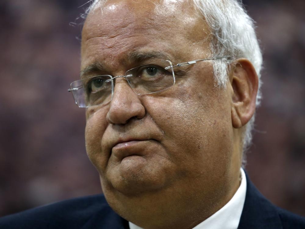 Saeb Erekat, Secretary-General of the Palestine Liberation Organisation and chief Palestinian negotiator, talks to reporters in the West Bank city of Ramallah in March. Erekat is being treated in a Jerusalem hospital after contracting COVID-19.