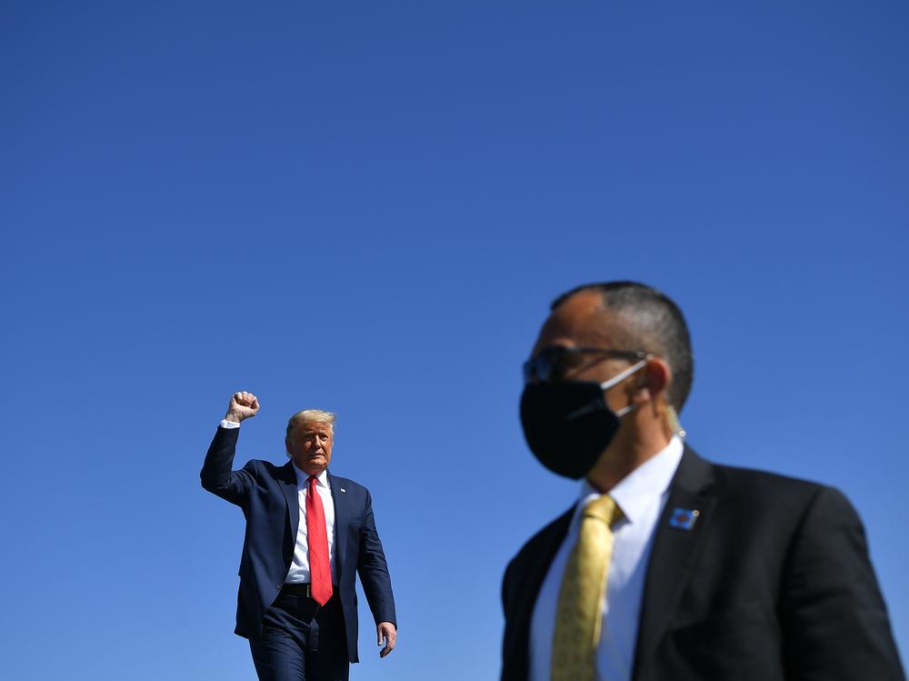 President Trump arrives to speak during a rally Monday at Prescott Regional Airport in Prescott, Ariz., one of many stops he has made recently in potential swing states.
