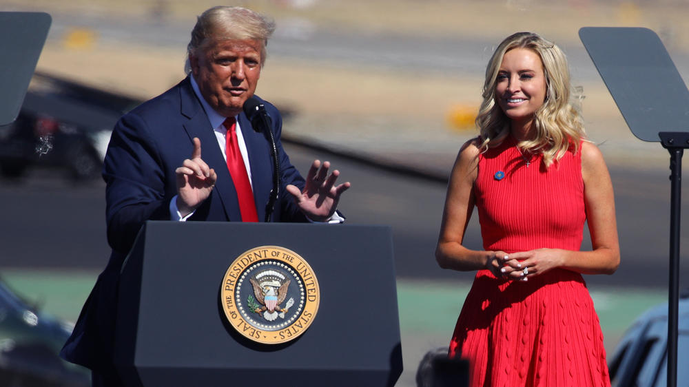 President Trump introduces White House press secretary Kayleigh McEnany at the rally in Prescott, Ariz. Like the president, McEnany has recovered from the coronavirus.