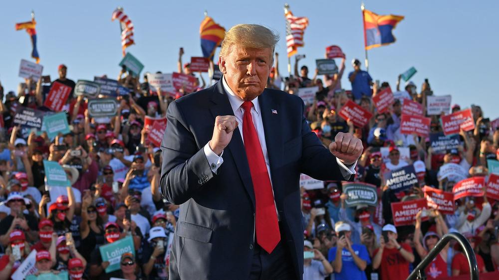 President Trump dances as he leaves a rally at Tucson International Airport in Arizona on Monday.